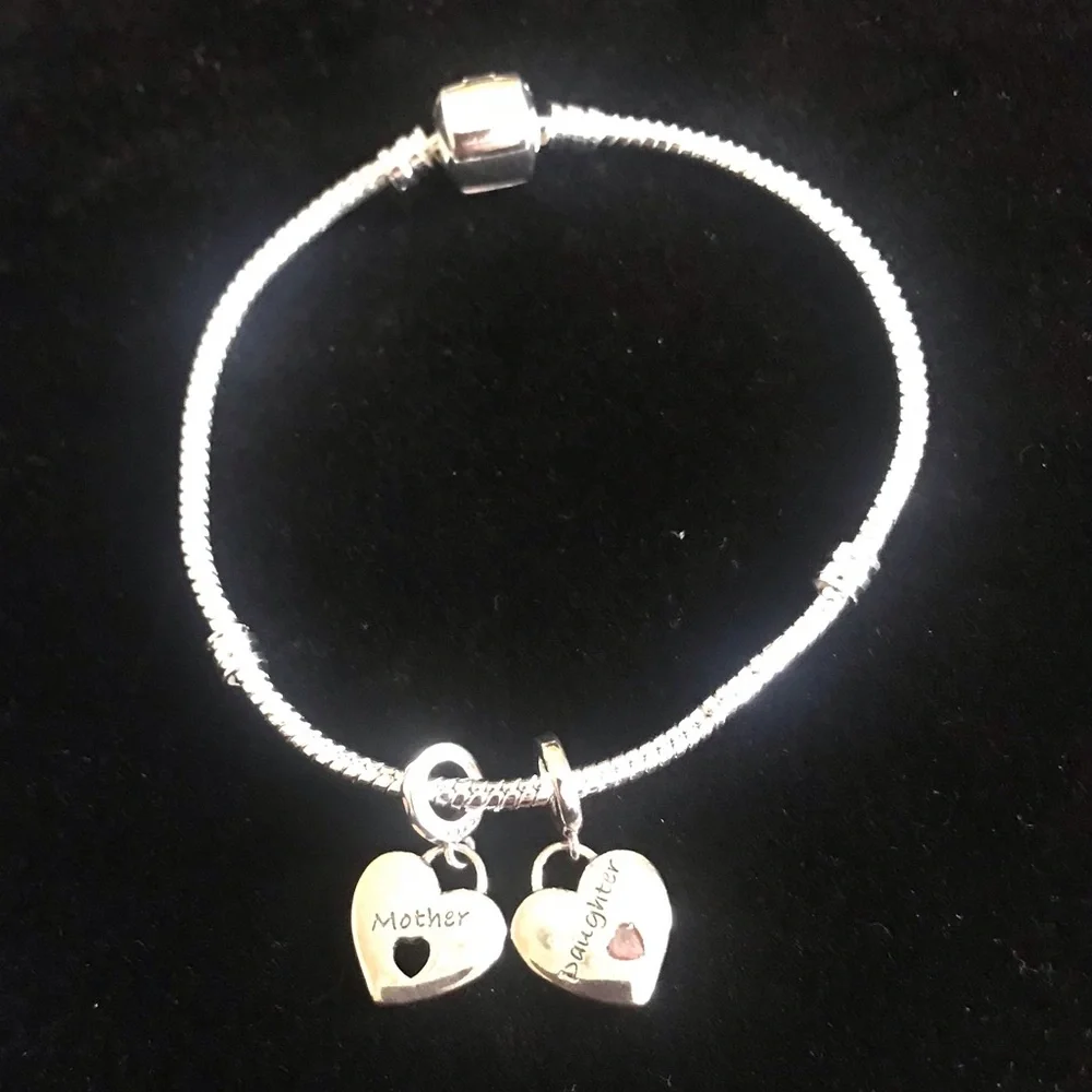 Sterling silver charm bracelet with 2 charms - Picture 1 of 2